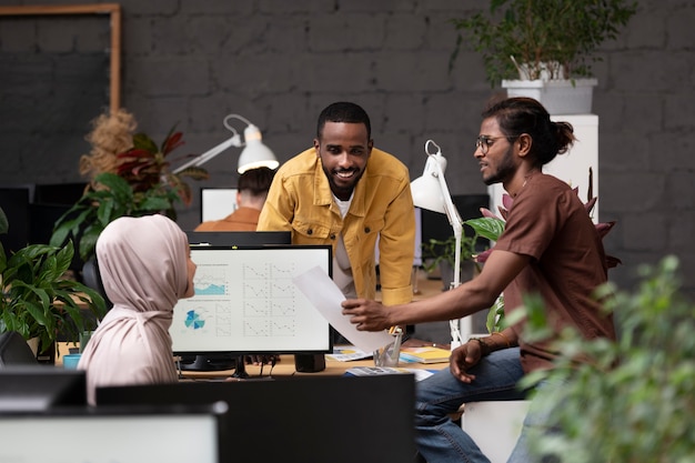 medium shot colleagues working together