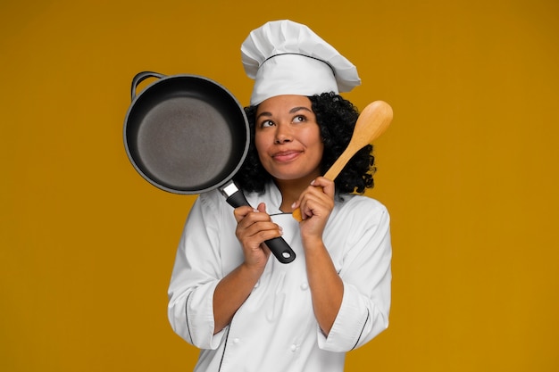 Medium shot cook posing in studio