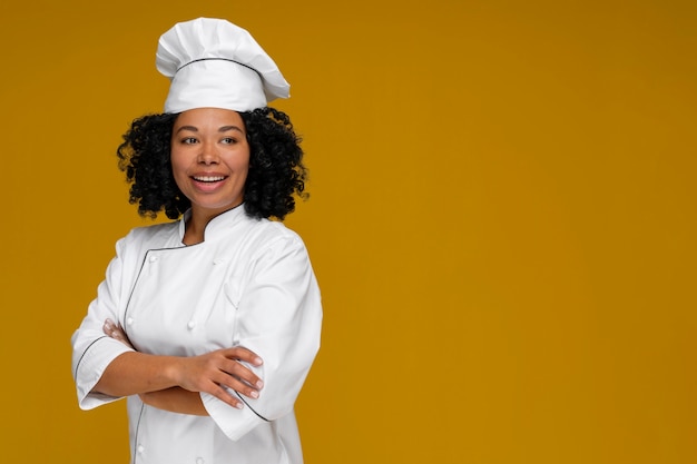 Medium shot cook posing in studio