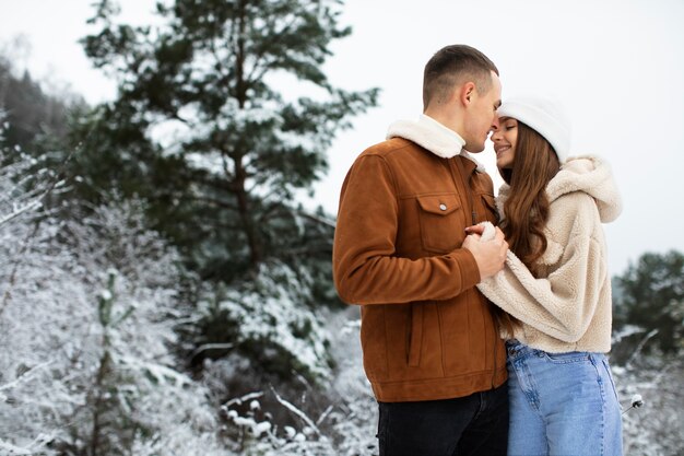 Medium shot couple being romantic