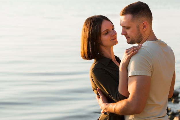 medium shot couple holding each other