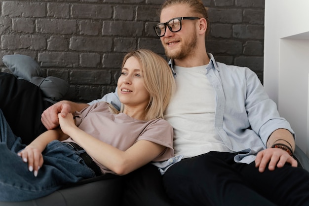 Medium shot couple sitting together