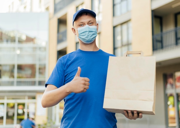 Medium shot delivery man with bag