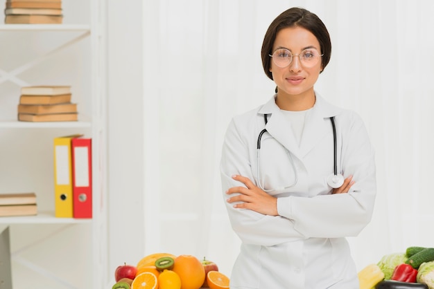 Medium shot doctor with her arms crossed