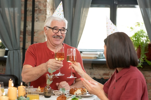 Medium shot family clinking glasses