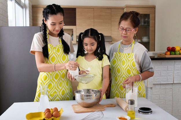medium shot family cooking