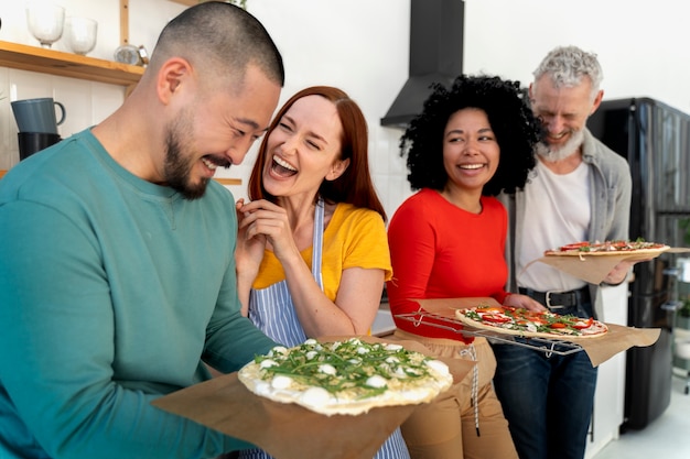 Medium shot family with delicious pizza