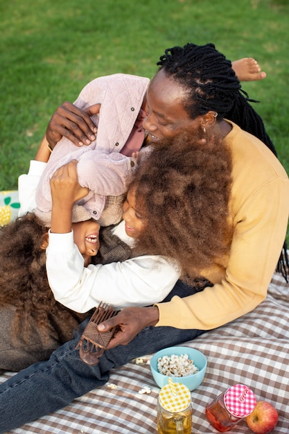 Medium shot father playing with kids