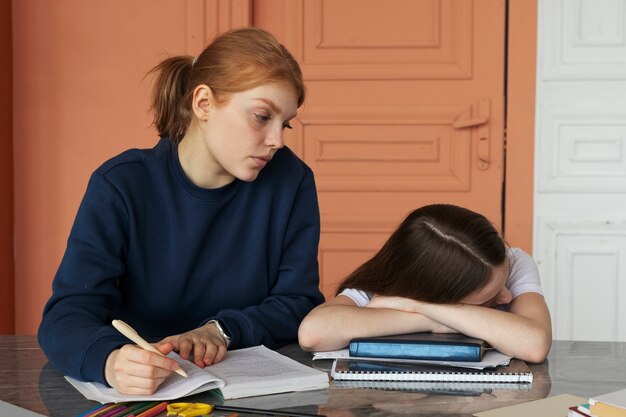 Photo medium shot girl sleeping on books