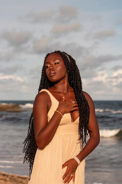 Medium shot greek goddesses posing at the beach