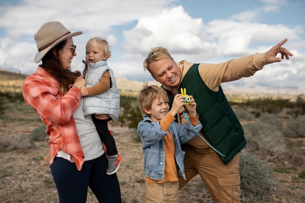 Medium shot happy family in american desert