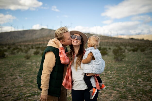 Medium shot happy family in american desert