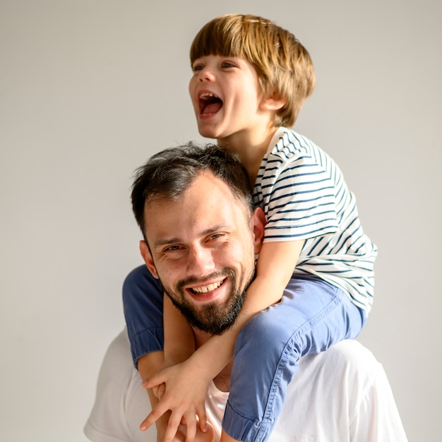 Medium shot happy father and son