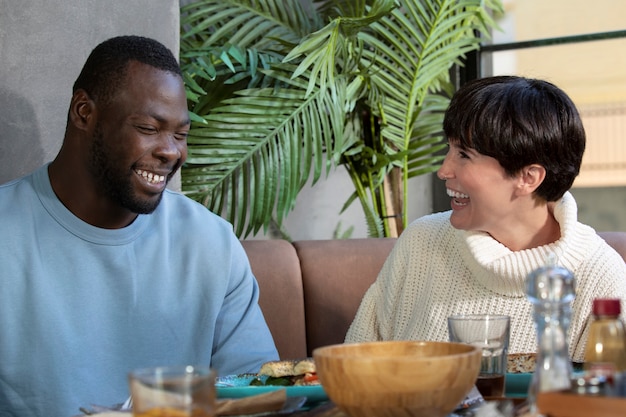 Medium shot happy people at table