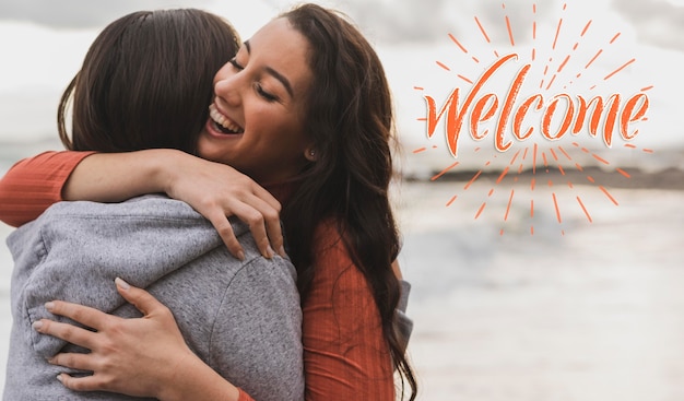 Photo medium shot happy women hugging