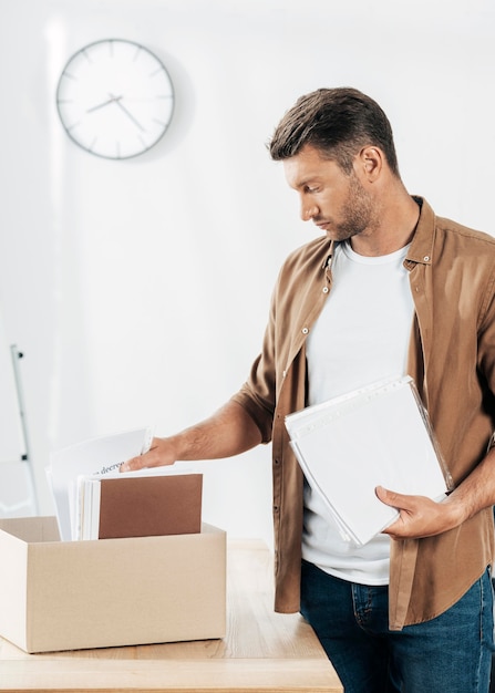 Medium shot man holding documents