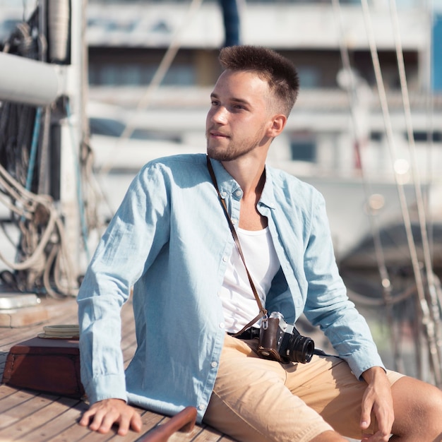 Medium shot man sitting on boat