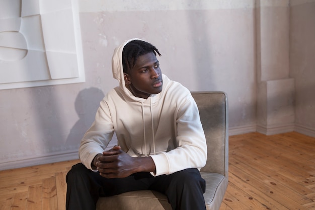 Medium shot man sitting on chair