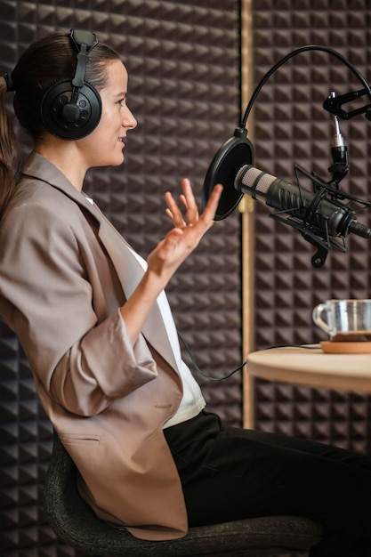 Medium shot man talking at microphone