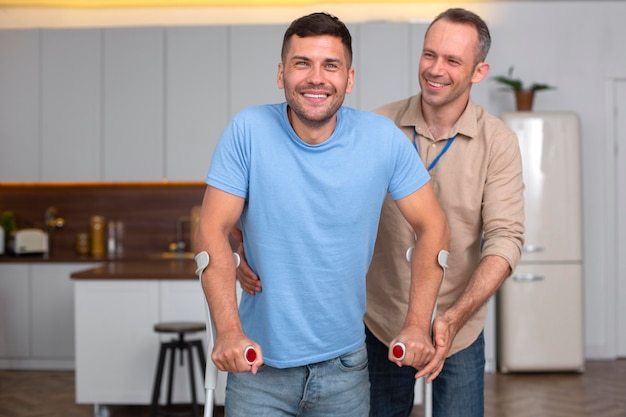 Medium shot man walking with crutches