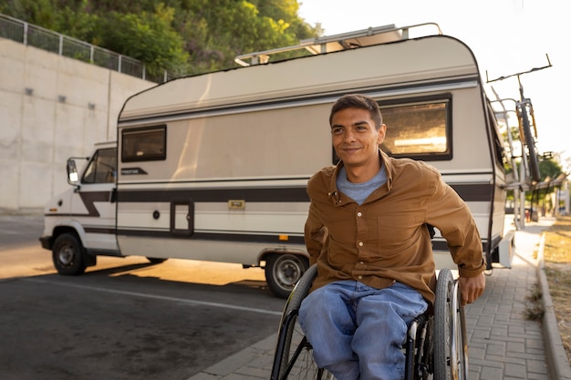 Medium shot man in wheelchair outdoors