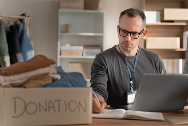 Medium shot man with laptop