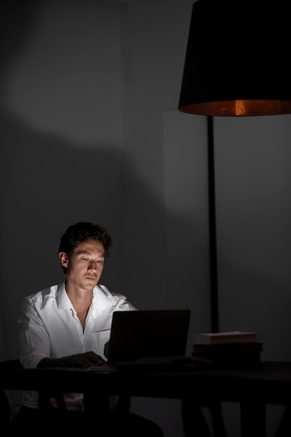 medium shot man working at night