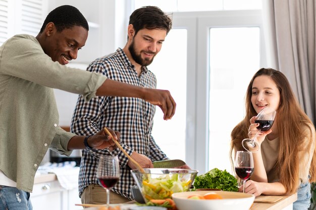 Medium shot men cooking indoors