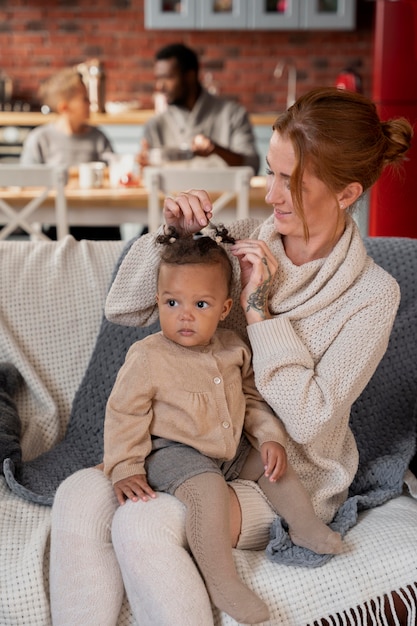 medium shot mother with kid on couch