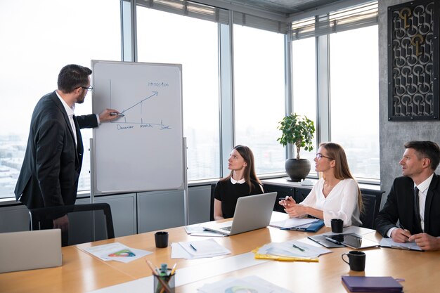 Medium shot people in business meeting