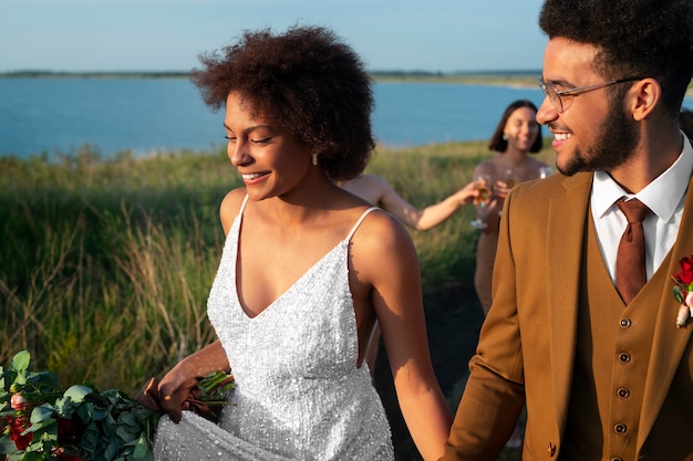 Medium shot people celebrating wedding in nature