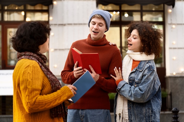 Medium shot people holding books