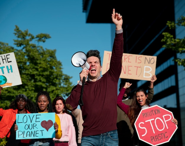 Medium shot people protesting to save planet