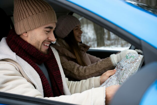 Medium shot people traveling by car