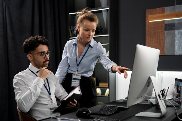 medium shot people working together on project