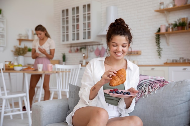 Medium shot roommates with delicious food