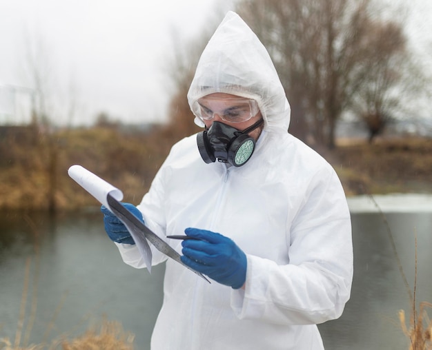 Medium shot scientist holding clipboard