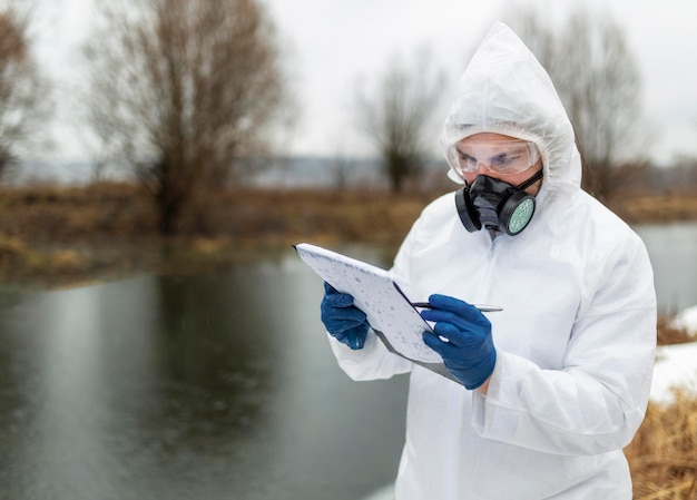 Medium shot scientist wearing protective suit