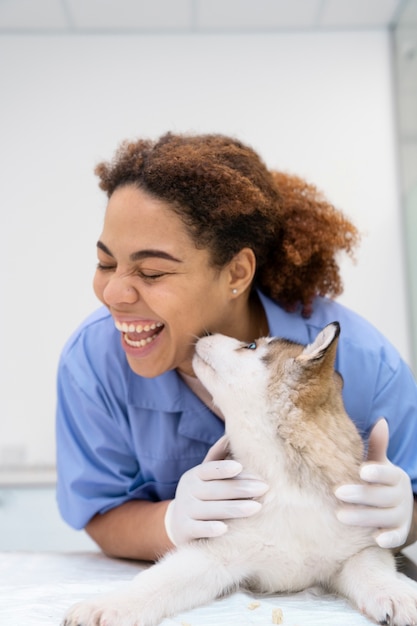 Medium shot smiley doctor and cute dog