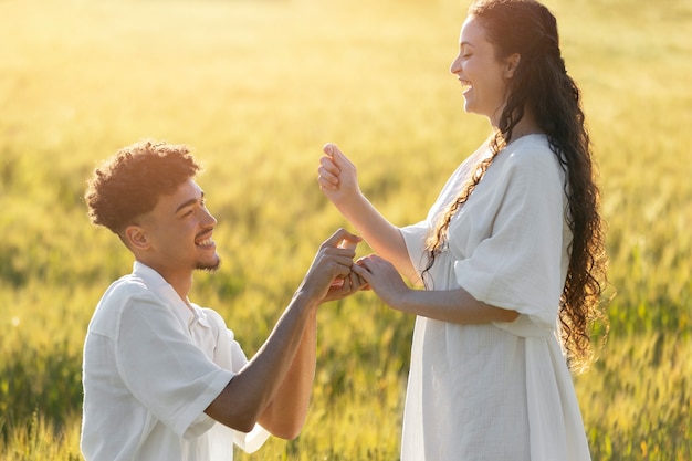 Medium shot smiley man proposing