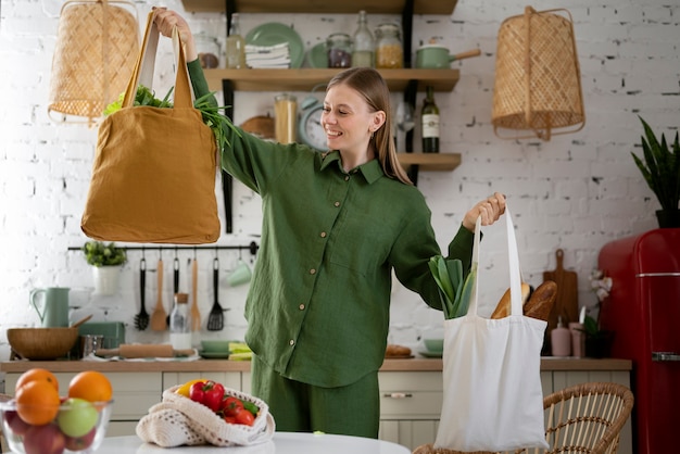 medium shot smiley woman with bags