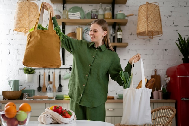 Medium shot smiley woman with bags