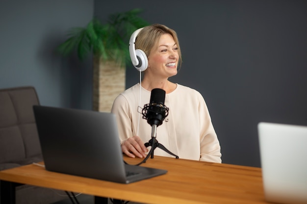 Medium shot smiley woman with mic