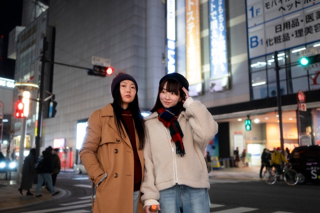 medium shot teenage girls in city