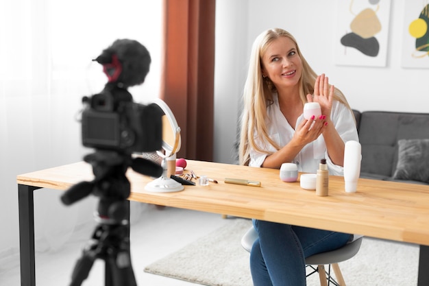 Medium shot woman holding container