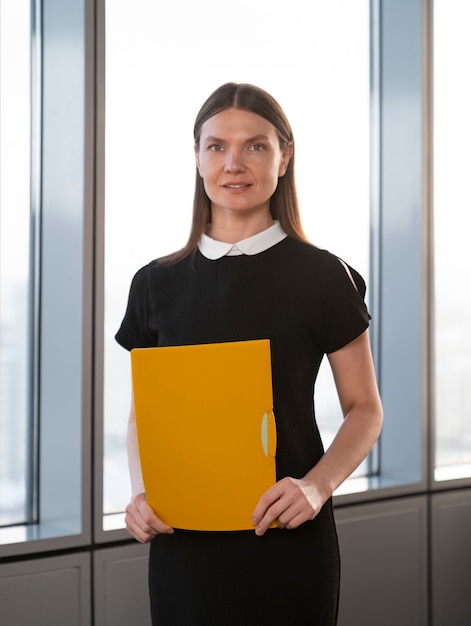 Medium shot woman holding document