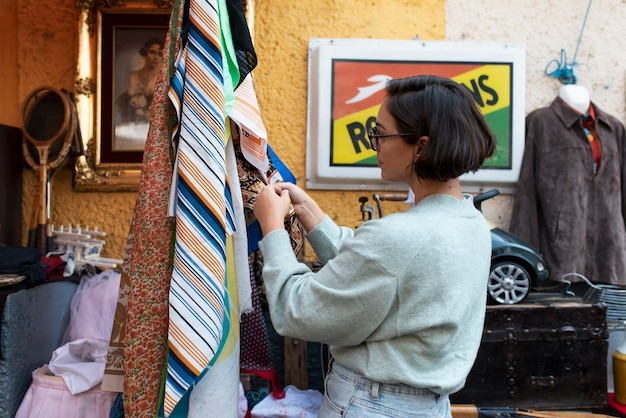 Medium shot woman holding scarf