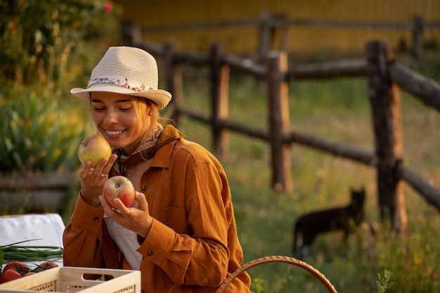 Medium shot woman living at farmhouse