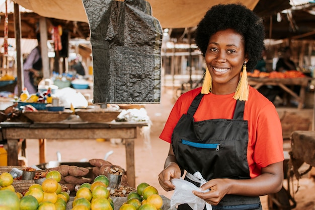 Photo medium shot woman posing at market