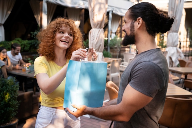 Medium shot woman receiving gift